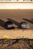 THE GRIT LIFE 7 PANEL TRUCKER HAT