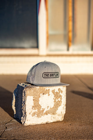 THE GRIT LIFE 6 PANEL TRUCKER HAT