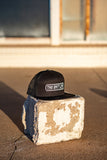 THE GRIT LIFE 7 PANEL TRUCKER HAT