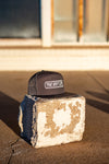 THE GRIT LIFE 7 PANEL TRUCKER HAT